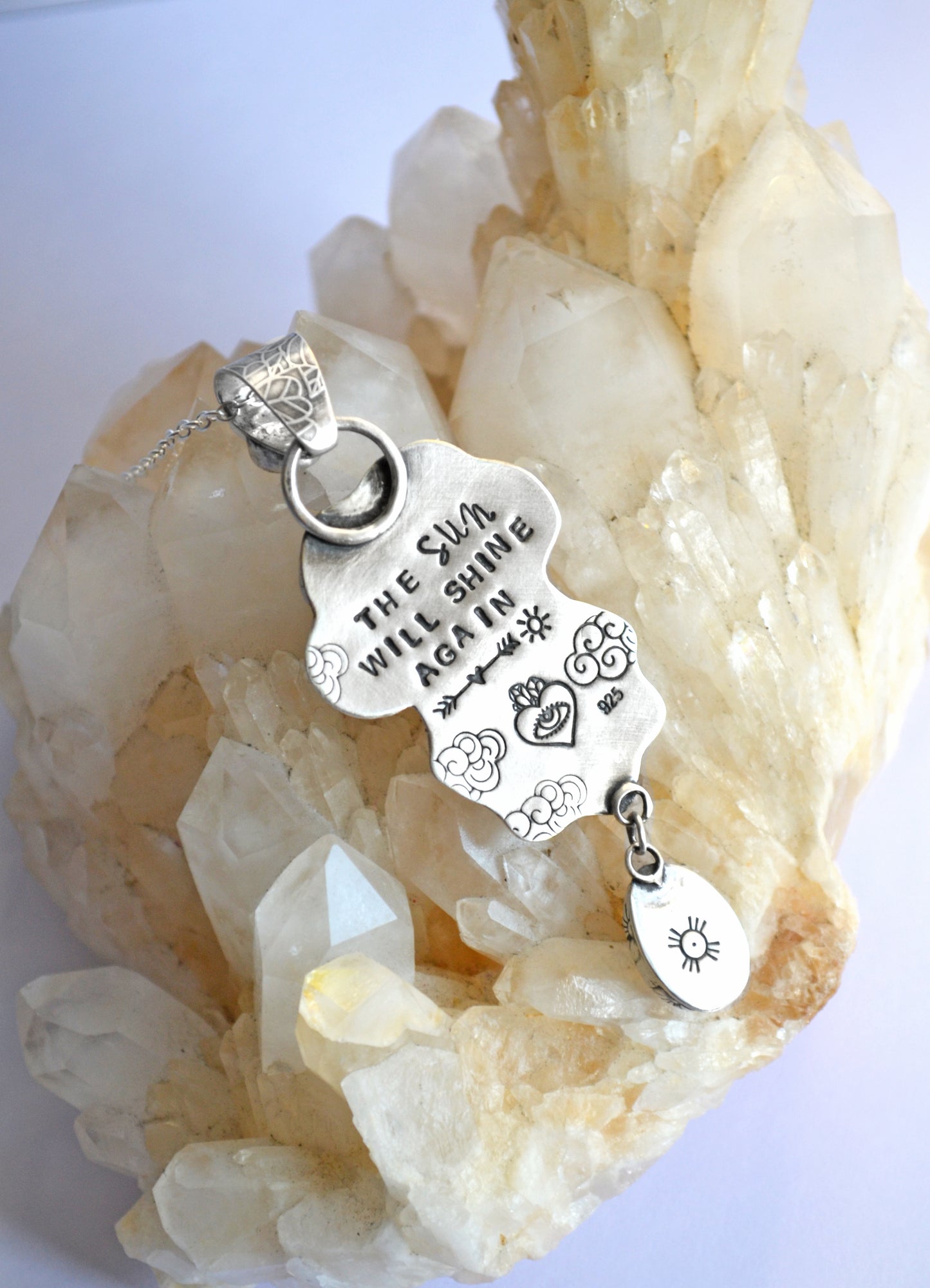 Sun and cloud pendant