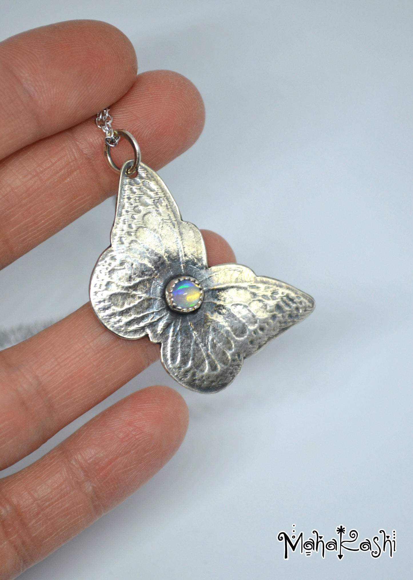 Butterfly pendant with Ethiopian Opal