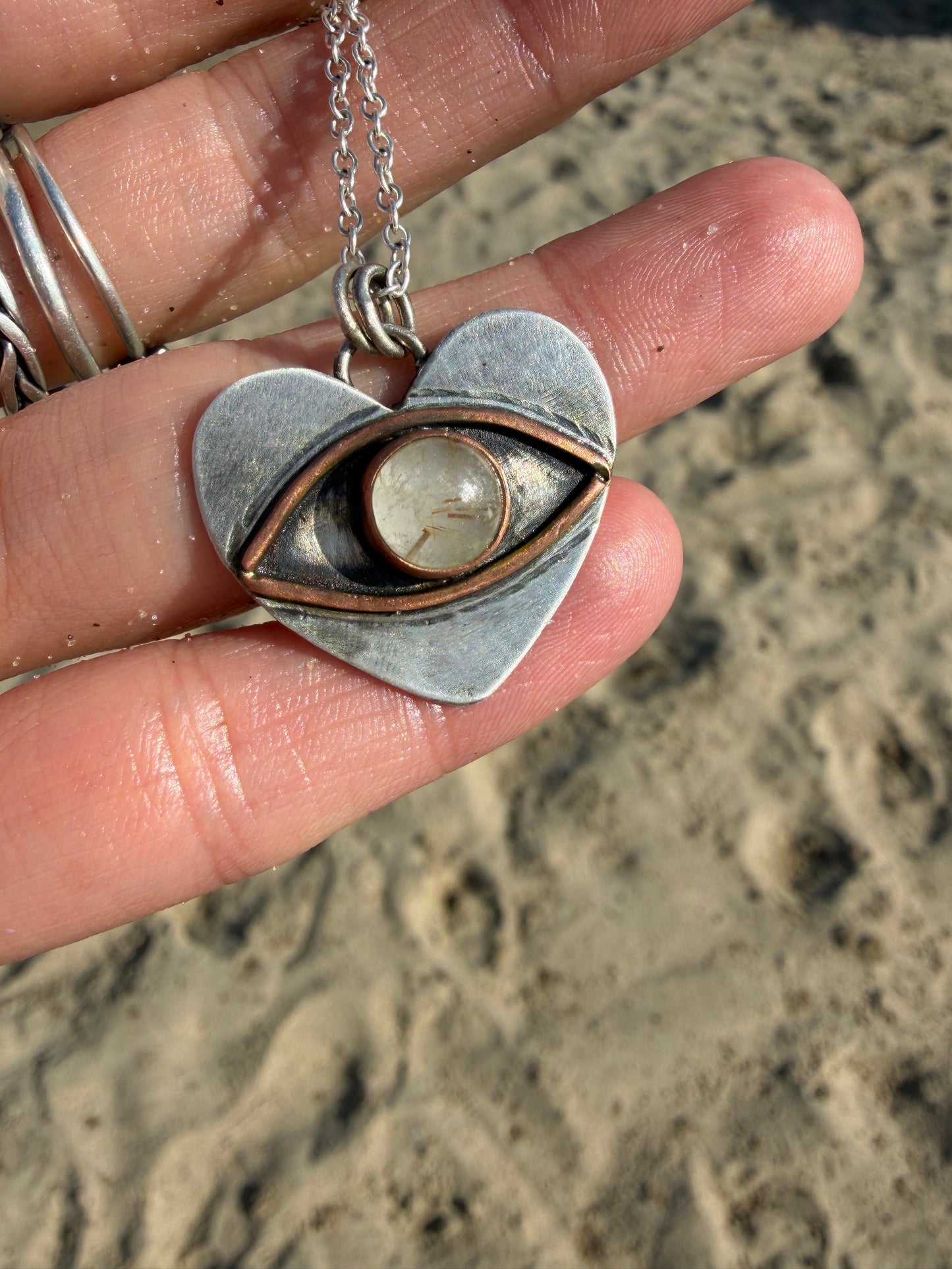 Eye heart pendant