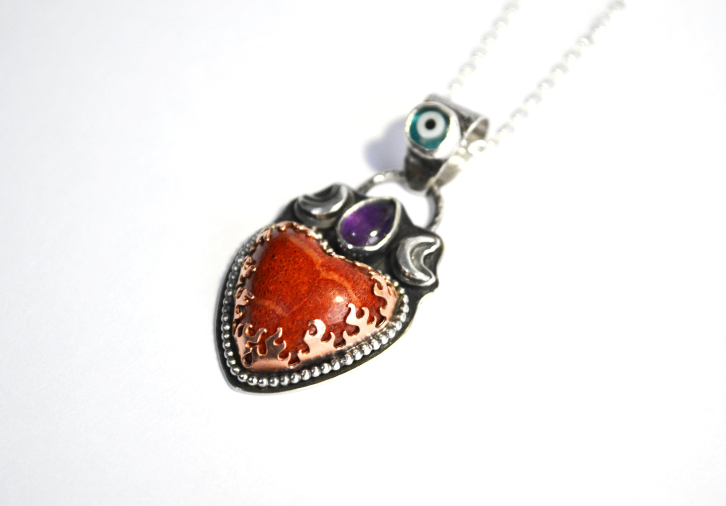 Heart dreamer pendant with Japanese Coral,Amethyst and glass evil eye